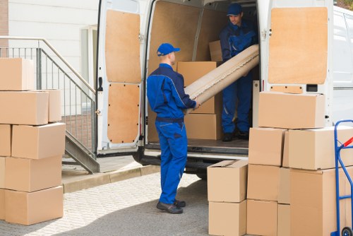 Man and van moving through a residential street in St Johns Wood