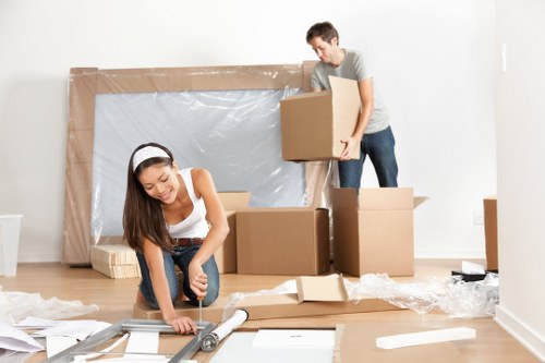 Professional moving van loading items in a St Johns Wood street