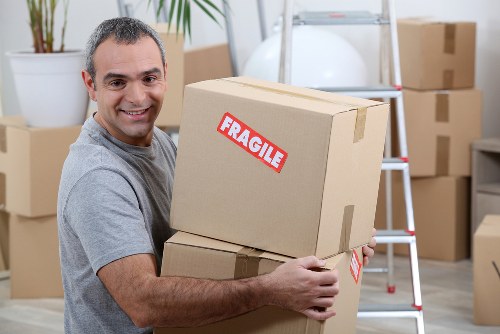 Van moving team preparing items safely before loading