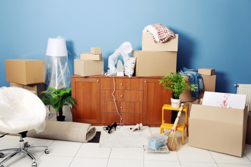 Removal team planning a move in St Johns Wood with boxed belongings and furniture
