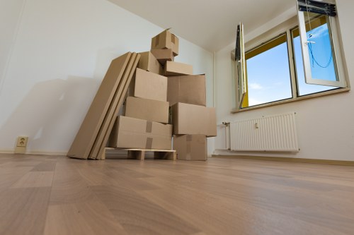 Packed boxes and furniture ready for removal truck loading