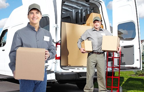 Professional movers handling a house relocation near St Johns Wood