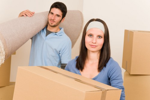 Packed boxes and household items being secured inside a moving truck
